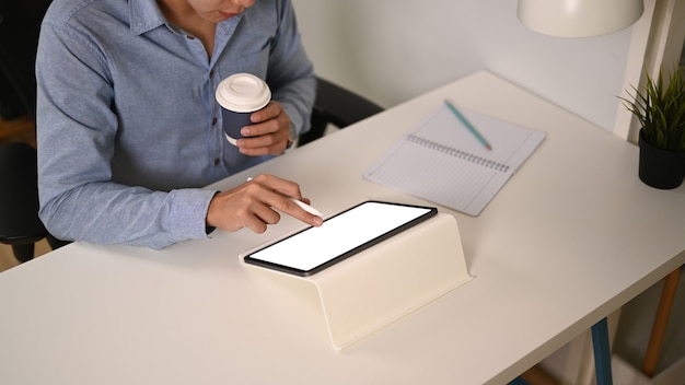A person sitting at a desk, focused on work, with a smartphone next to them displaying only a few, discreet notifications, illustrating the concept of smart notifications.