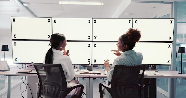 A diverse news team working in a modern newsroom, with computers and monitors displaying news headlines. The atmosphere is busy but focused, reflecting the importance of accurate and timely news reporting.