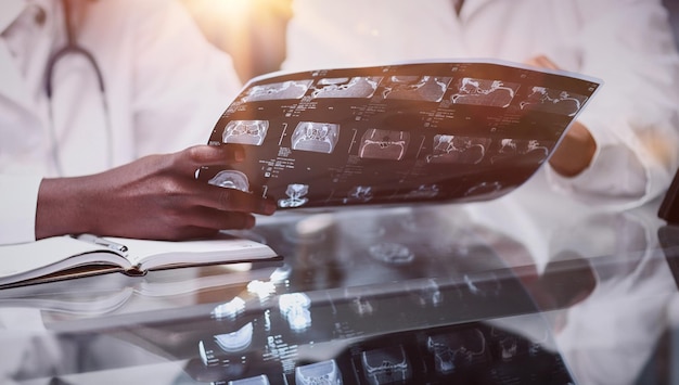 A close-up of various medical documents, including lab reports, x-rays, and doctor's notes, symbolizing the importance of compiling thorough and accurate medical evidence for a successful disability retirement claim.