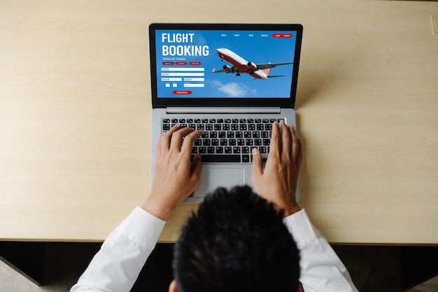 A person is using a laptop to search for flight deals on an airline booking website. The screen displays various flight options with prices, dates, and destinations. The background is a blurred image of a world map, symbolizing travel planning.