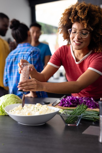 A candid image showing a volunteer sharing a meal with a local family in a humble Brazilian home, demonstrating cultural exchange and genuine connection.