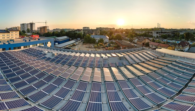 Wide shot of a large industrial rooftop completely covered with solar panels in Brazil, showcasing the potential of solar energy for commercial and industrial use in a sunny, urban environment.